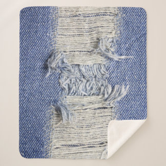 Torn blue denim: jeans texture. sherpa blanket