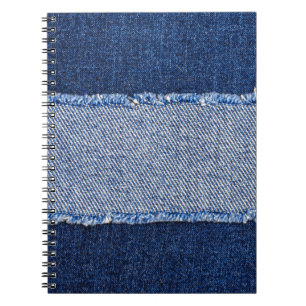 Torn denim: blue jeans fabric. notebook