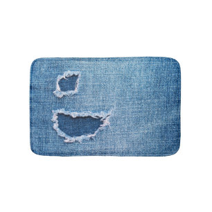Torn denim fabric texture, blue hues. bath mat