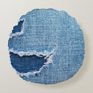 Torn denim fabric texture, blue hues. round cushion
