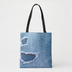 Torn denim fabric texture, blue hues. tote bag