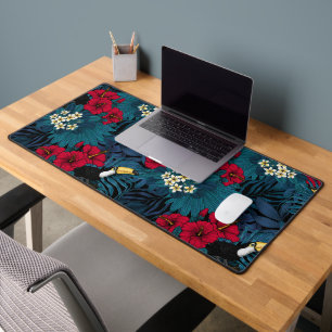 Toucans and tropical flora, green and red desk mat
