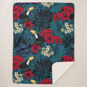 Toucans and tropical flora, green and red sherpa blanket