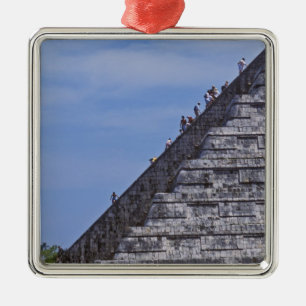 Tourists climbing stairs on ruins of El Metal Ornament