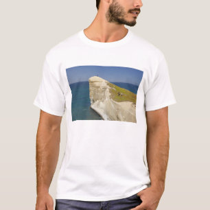 Tourists on cliff top at Tunnel Beach