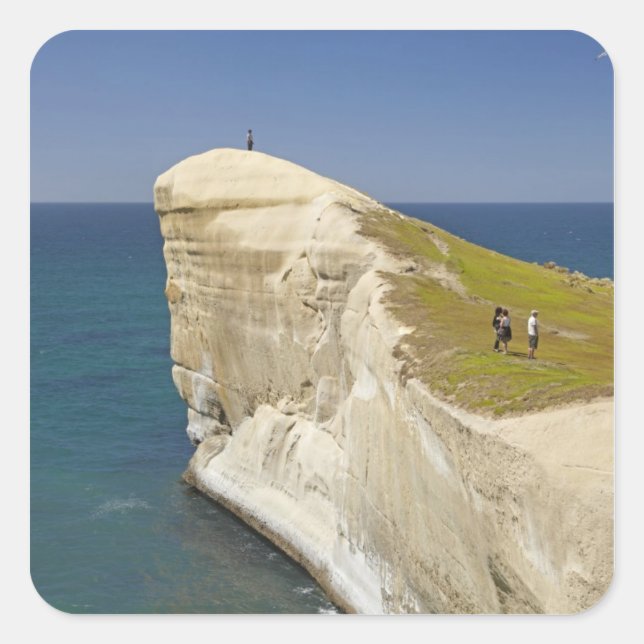 Tourists on cliff top at Tunnel Beach Square Sticker (Front)