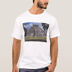 Tourists walk past an unrestored side of El T-Shirt