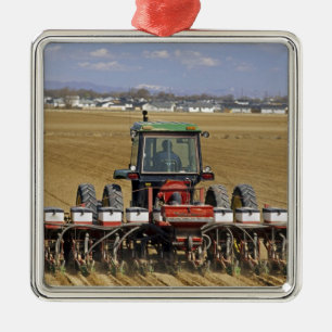 Tractor pulling a seed corn planter. metal ornament