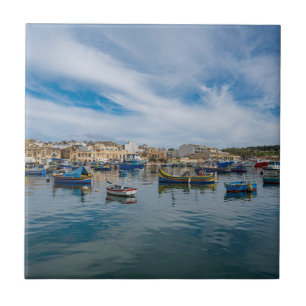 Traditional colorful fishing boats in the harbor ceramic tile