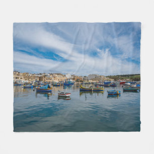 Traditional colorful fishing boats in the harbor fleece blanket