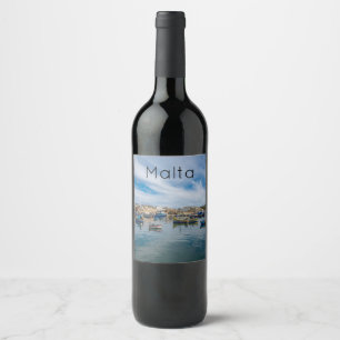 Traditional colorful fishing boats in the harbor wine label