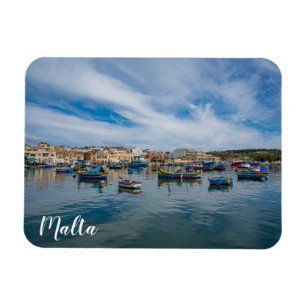Traditional colourful fishing boats in the harbour magnet