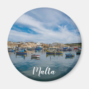 Traditional colourful fishing boats in the harbour magnet