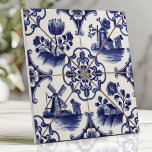 Traditional Delftware Blue Floral and Windmill Ceramic Tile<br><div class="desc">Capture the charm of traditional Dutch craftsmanship with this Delftware-style tile featuring intricate cobalt blue floral designs and scenic windmills on crisp white ceramic. The hand-painted details and delicate brushwork evoke a vintage folk art aesthetic, making this tile perfect for backsplashes, accent walls, or adding timeless elegance to your home...</div>