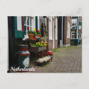 Traditional dutch wooden shoes on street postcard