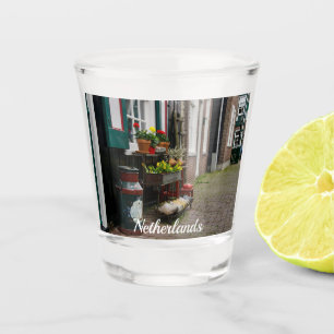 Traditional Dutch wooden shoes on street Shot Glass