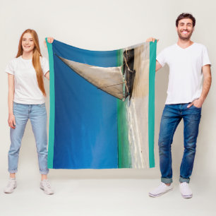 Traditional fishing boat on the beach fleece blanket