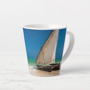 Traditional fishing boat on the beach latte mug