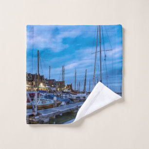 Traditional fishing town night scene wash cloth