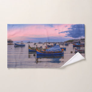 Traditional Maltese boats in Marsaxlokk Hand Towel