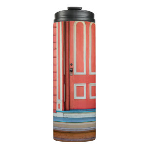 Traditional red painted wooden door and porchdoor, thermal tumbler