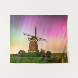 Traditional windmill under the Northern Lights Tapestry