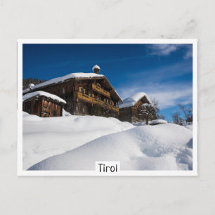Traditional wooden cabins in de snow postcard