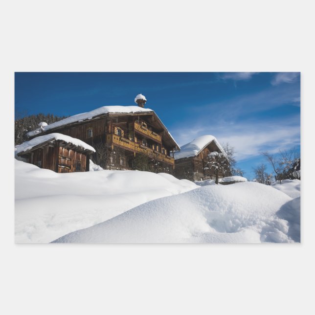 Traditional wooden cabins in de snow rectangular sticker (Front)