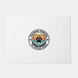 Training Humans to Speak Dogs Vintage Paw Badge_1 Doormat