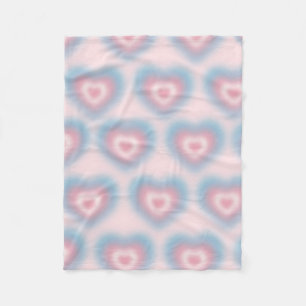 Trans flag colors on a blurred heart fleece blanket