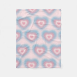 Trans flag colours on a blurred heart fleece blanket