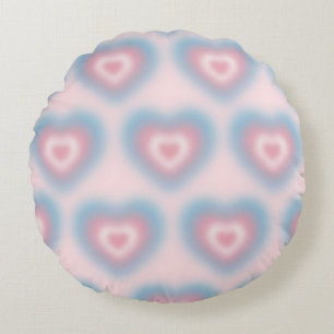 Trans flag colours on a blurred heart round cushion