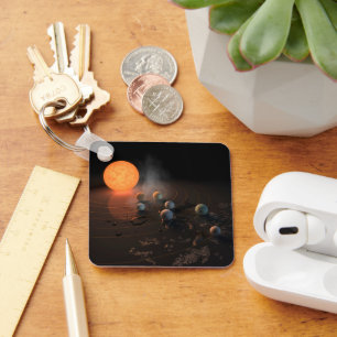 Trappist-1's Seven Planets In Orbit Around Star. Key Ring