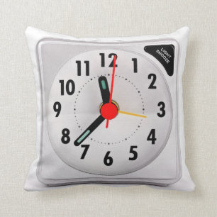 Travel alarm clock on a pillow