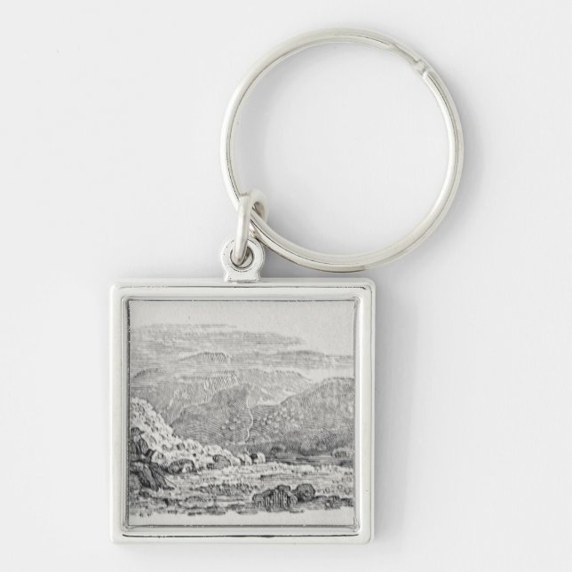 Traveller reading beneath a milestone key ring (Front)