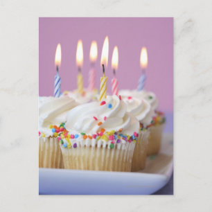 Tray of birthday cupcakes with candles postcard