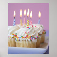Tray of birthday cupcakes with candles