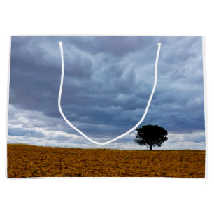 Tree in an empty field large gift bag