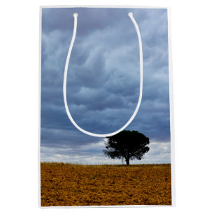 Tree in an empty field medium gift bag