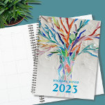 Tree of Life Personalised 2023 Planner<br><div class="desc">This unique Planner is decorated with a brightly coloured Tree of Life on a pale grey background. The original design was made in mosaic using tiny pieces of brightly coloured glass. Customise it with your name and year. To edit further use the Design Tool to change the font, font size,...</div>