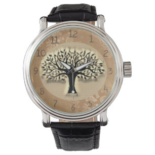 Tree stands in front of a landscape clock watch