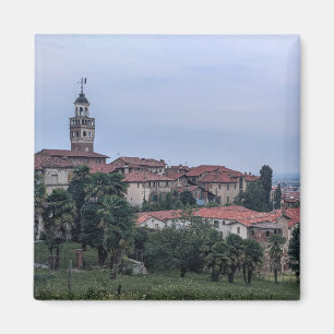 Trees and buildings in city against sky magnet