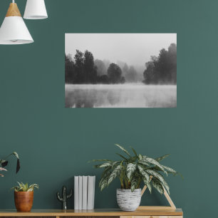 Trees disappearing in morning fog above the lake poster