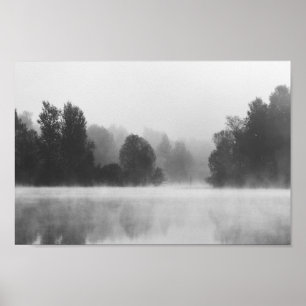 Trees disappearing in morning fog above the lake poster
