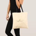 Trendy Black Gold Monogram Script Initials Name Tote Bag<br><div class="desc">Modern, minimalist personalised tote bag featuring a trendy handwritten script monogram or initials and name in editable black and gold colours for a stylish or elegant professional look. ASSISTANCE: For help with design modification or personalisation, colour change, resizing, transferring the design to another product or if you would like coordinating...</div>