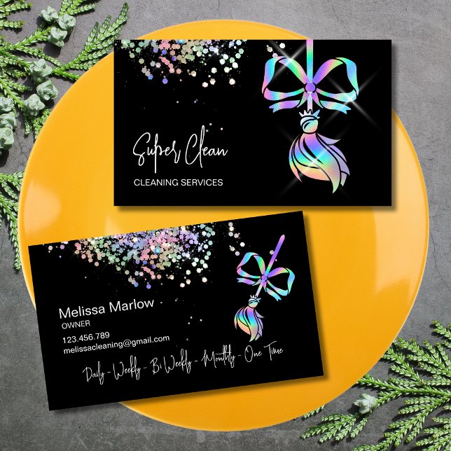 Trendy Bow Maid Cleaning House Sparkle Holographic Business Card (business card with holographic broom with a bow on the black background)