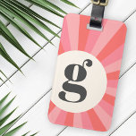 Trendy retro sunburst minimal monogram pink cream luggage tag<br><div class="desc">Modern,  trendy luggage tag with your monogram initial in dark grey on a cream coloured circle on a pink retro sunburst background. On the back are customisable template fields for your name and contact information. All colours can be edited in the design tool.</div>