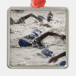Triathletes competing in swim leg of triathlon. metal tree decoration