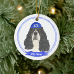 Tricolor English Springer Spaniel Hanukkah Ceramic Ornament<br><div class="desc">Celebrate your favourite mensch on a bench with a personalised ornament! This design features a sweet illustration of a tricolor english springer spaniel dog with a blue and white yarmulke. For the most thoughtful gifts, pair it with another item from my collection! To see more work and learn about this...</div>