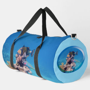 Triggerfish rests on a coral block at coral reef duffle bag